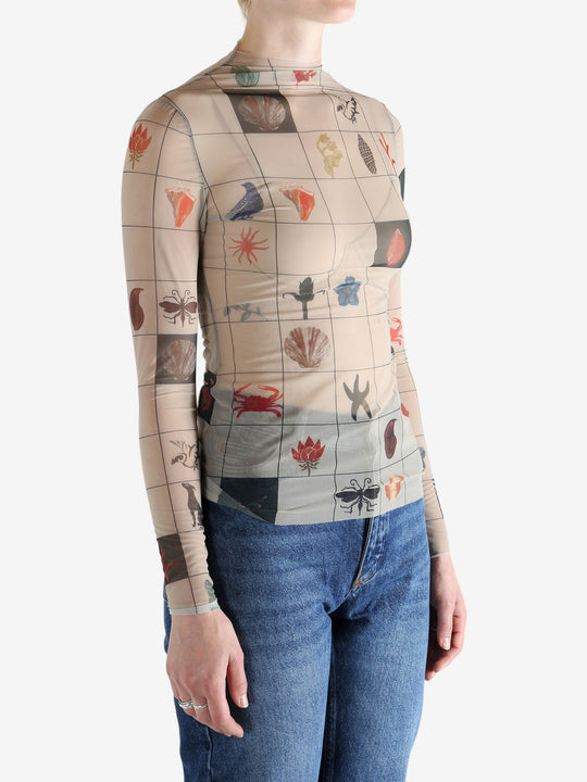 Tan top worn by a person, showing the top's fit