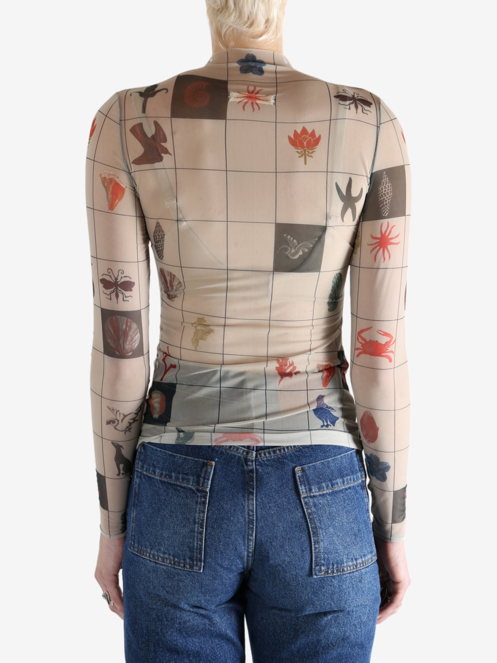 Tan top worn by a person, showing the top's fit