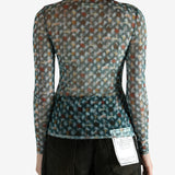 Blue top worn by a person, showing the top's fit