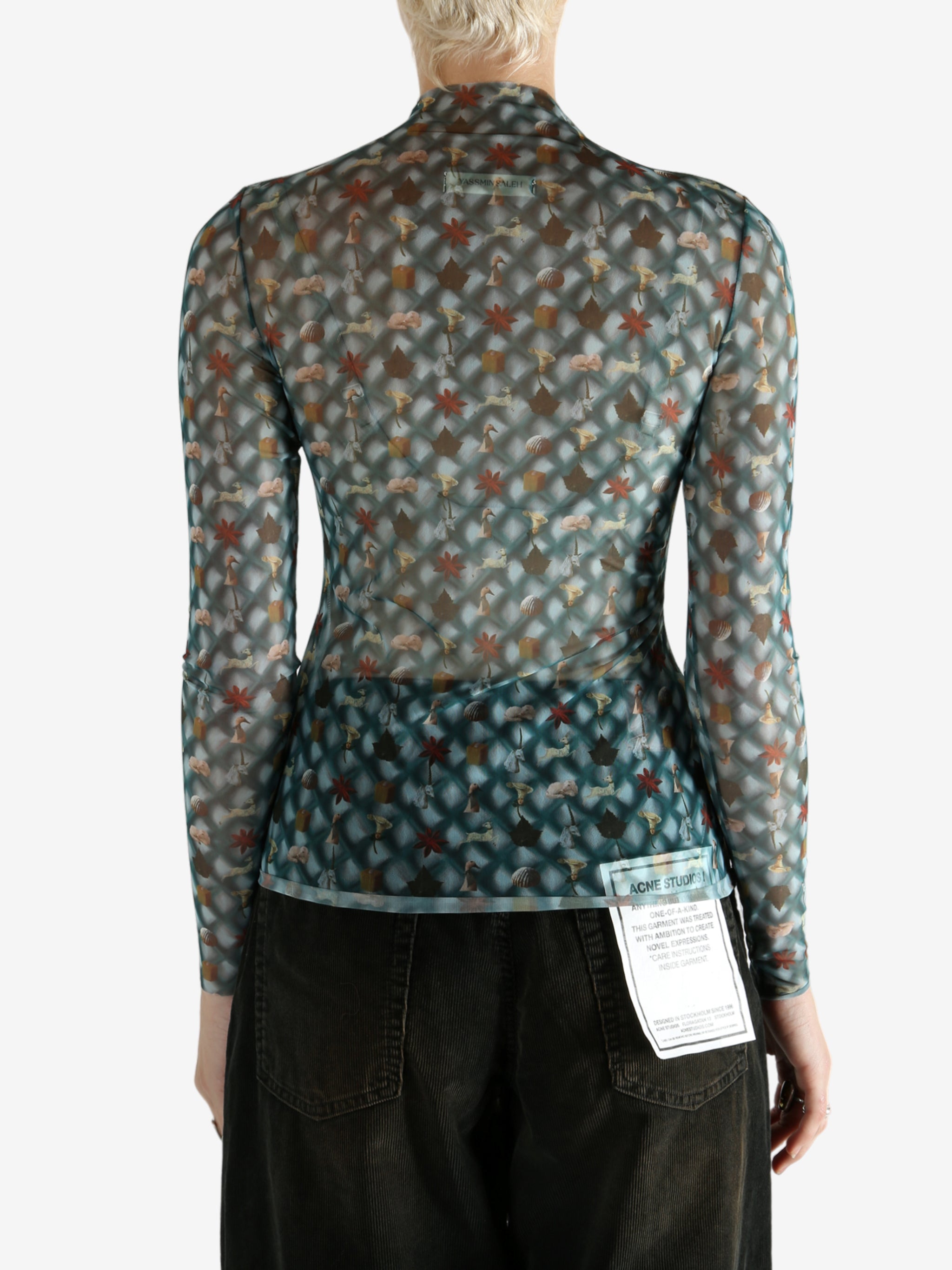 Blue top worn by a person, showing the top's fit