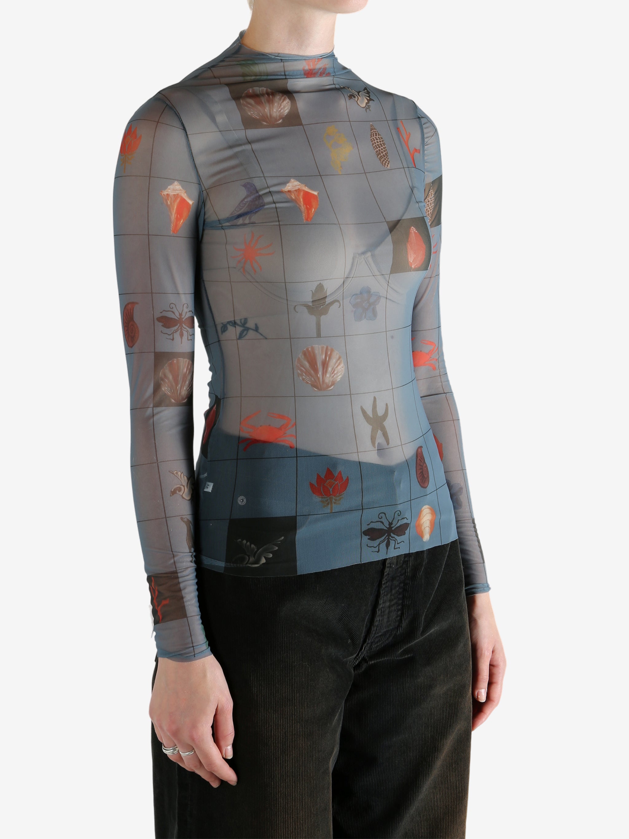 Blue top worn by a person, showing the top's fit