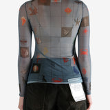 Blue top worn by a person, showing the top's fit