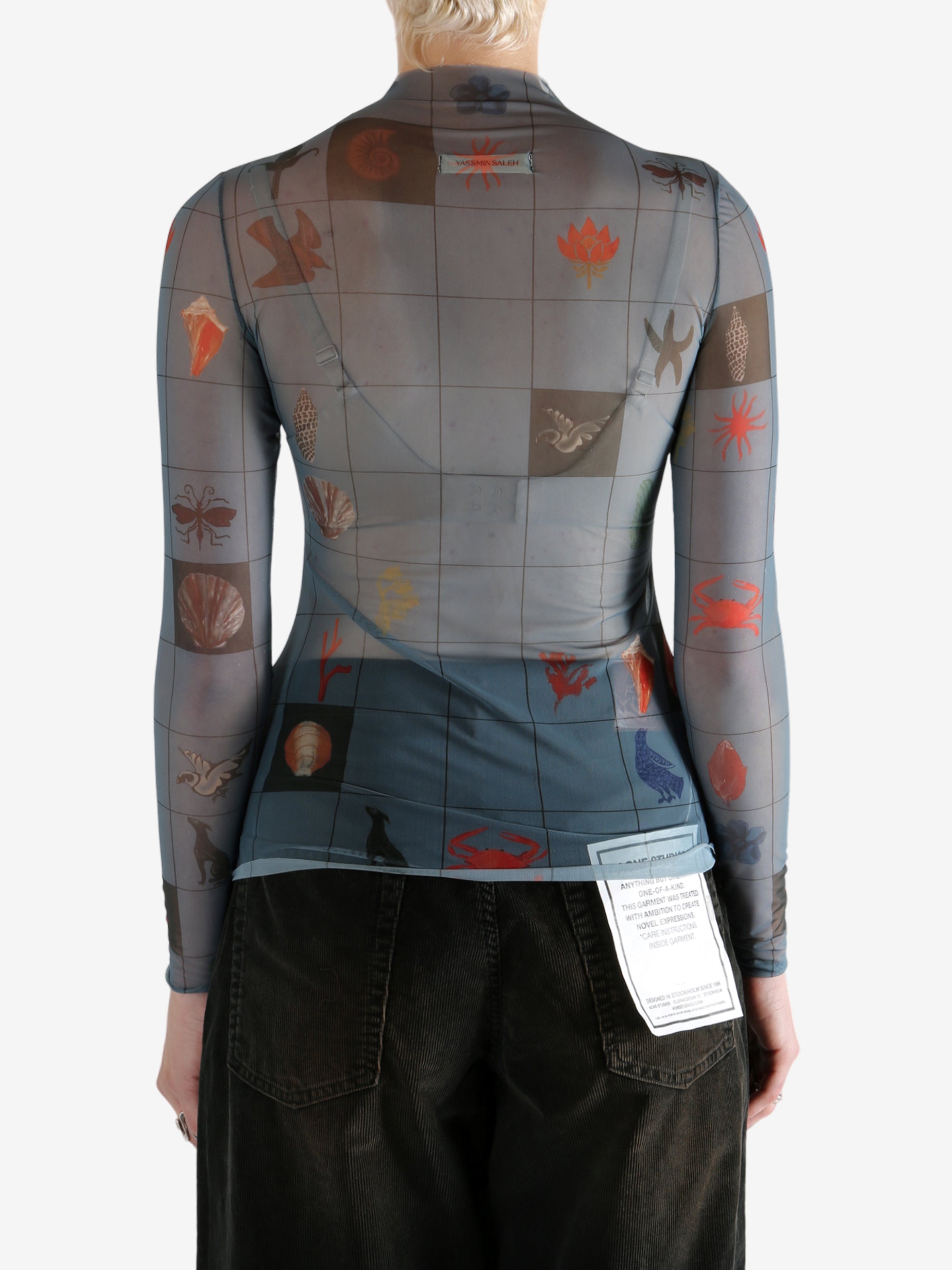 Blue top worn by a person, showing the top's fit