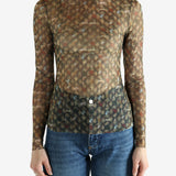 Brown top worn by a person, showing the top's fit