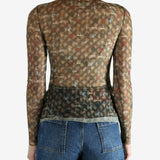 Brown top worn by a person, showing the top's fit