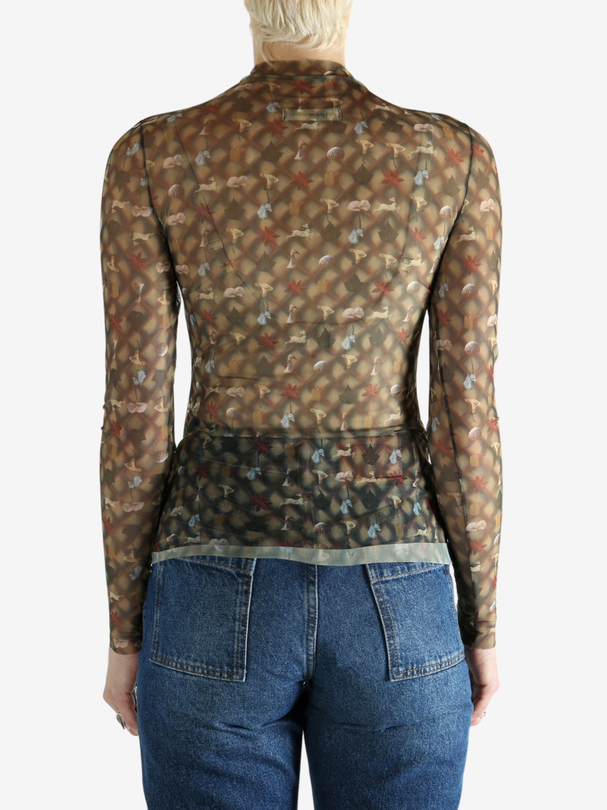 Brown top worn by a person, showing the top's fit