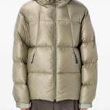 Tan jackets worn by a person, showing the jackets fit