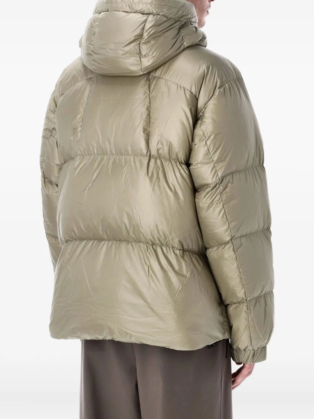 Tan jackets worn by a person, showing the jackets fit