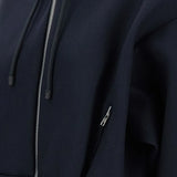 Close up of navy jackets, showing texture of the viscose fabric