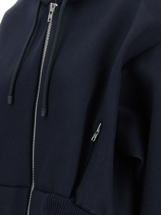 Close up of navy jackets, showing texture of the viscose fabric