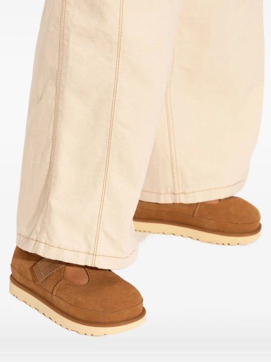 Orange shoes worn by a person, showing the shoes fit