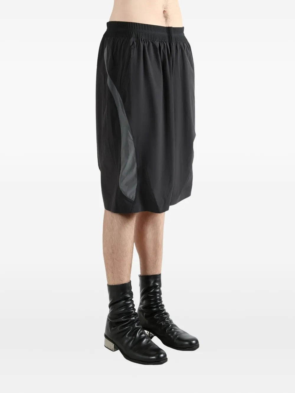 Black shorts worn by a person, showing the shorts's fit