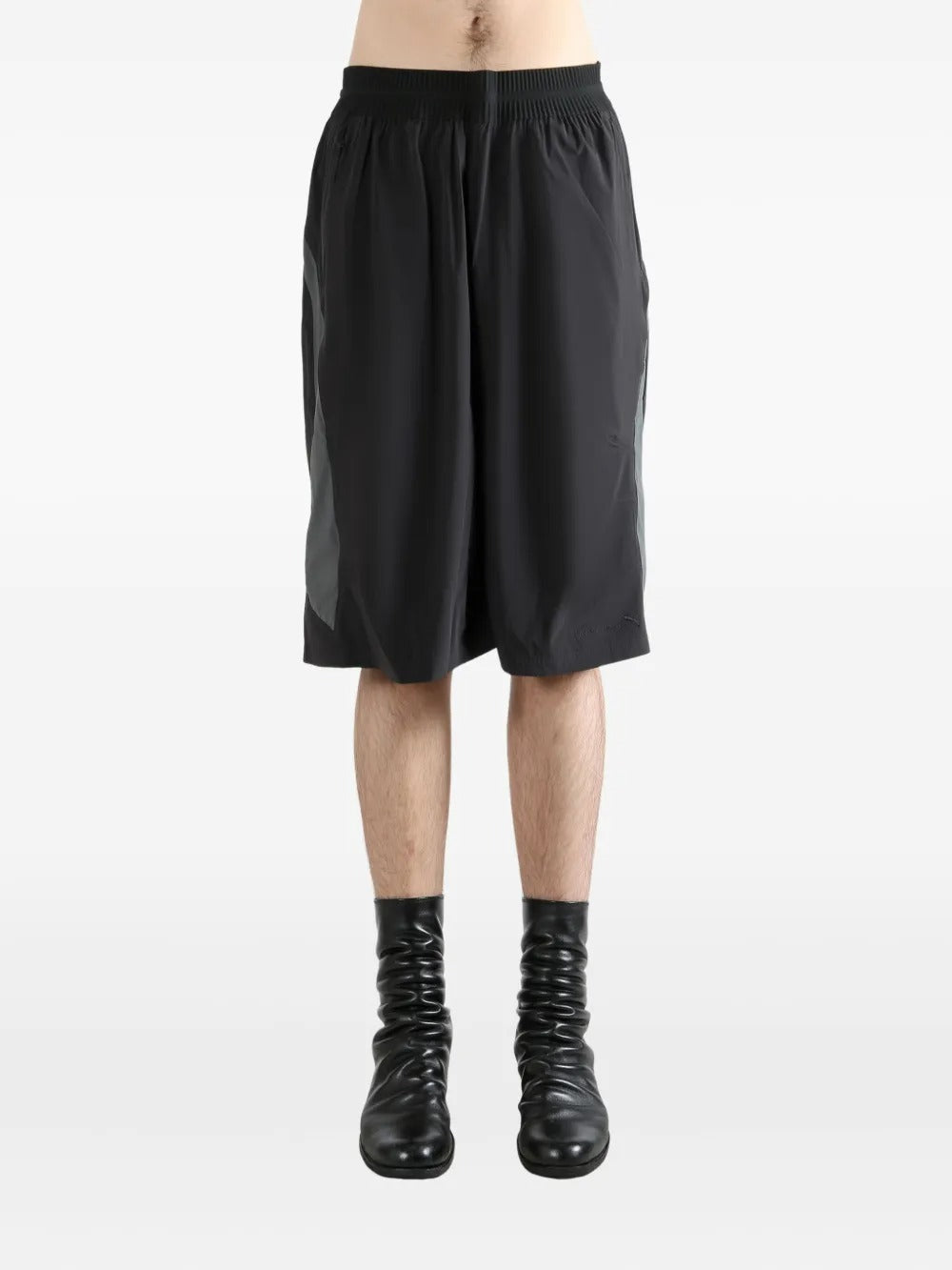 Black shorts worn by a person, showing the shorts's fit