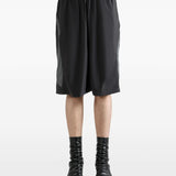 Black shorts worn by a person, showing the shorts's fit