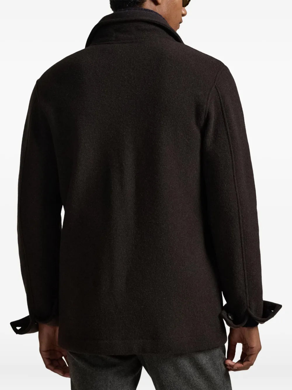 brown coat worn by a person, showing the coat fit