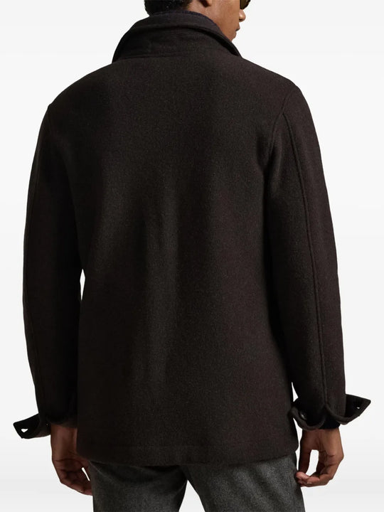 brown coat worn by a person, showing the coat fit