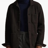 brown coat worn by a person, showing the  coat fit