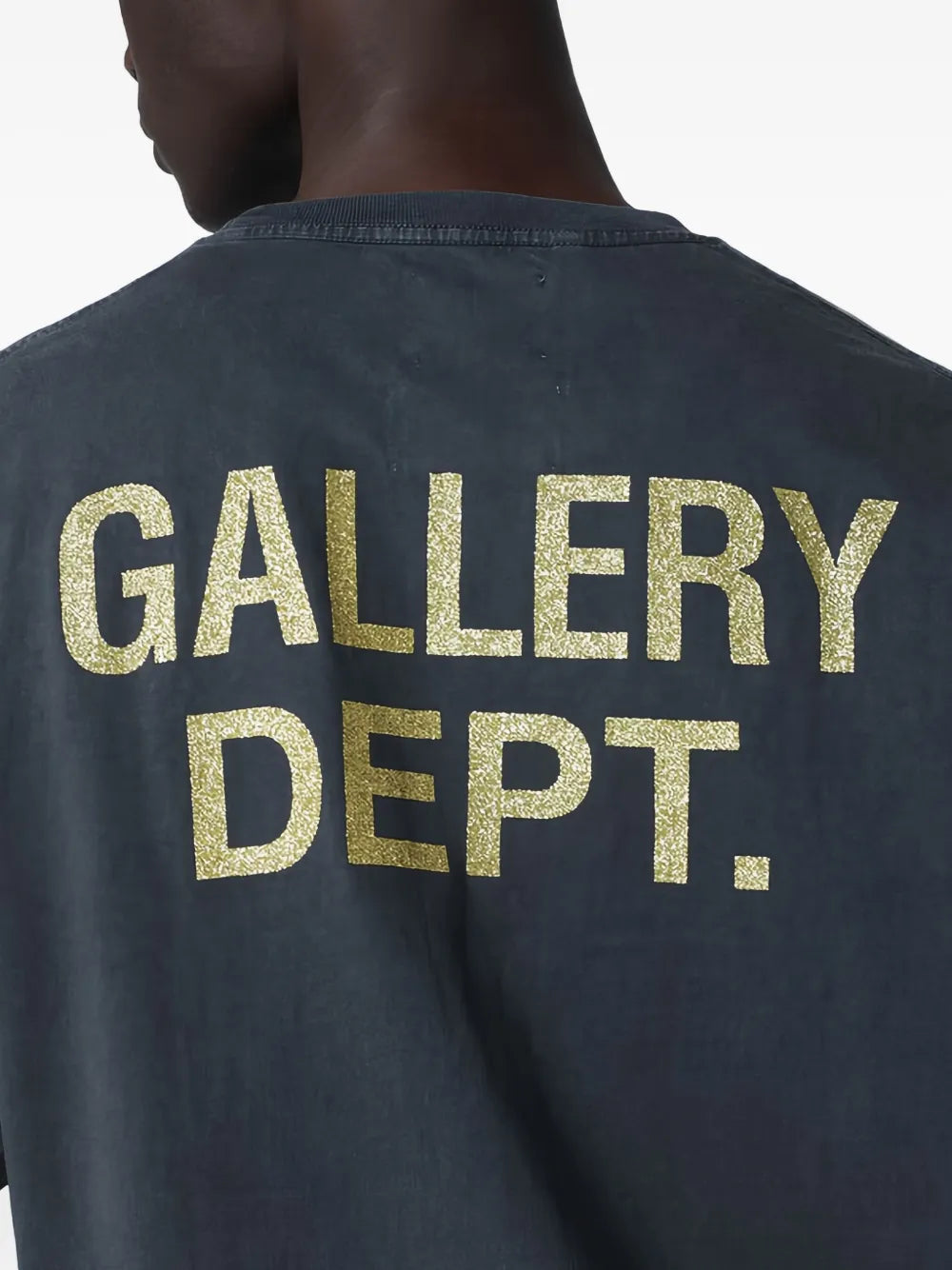 Close up of the black t-shirt, showing texture of the cotton fabric