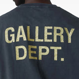 Close up of the black t-shirt, showing texture of the cotton fabric