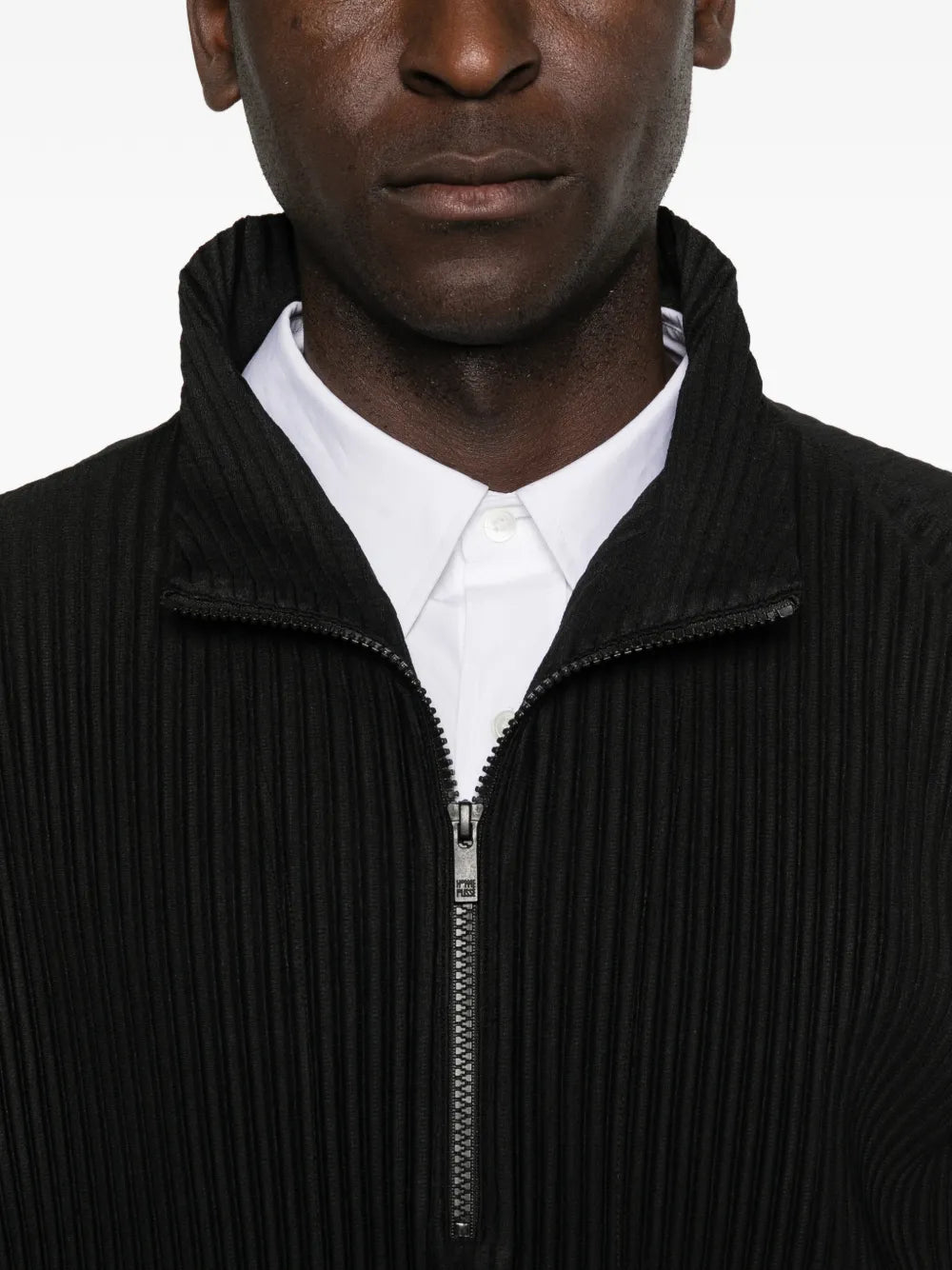 Close up of black t-shirt, showing texture of the polyester fabric
