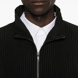 Close up of black t-shirt, showing texture of the polyester fabric