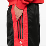 Close up of black pants, showing texture of the recycled polyester fabric