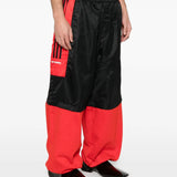 Black pants worn by a person, showing the pants fit