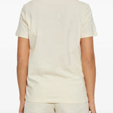 white t-shirt worn by a person, showing the t-shirt fit