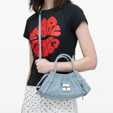 Blue bag worn by a person, showing the bag's fit