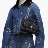 Black bags worn by a person, showing the bag's fit