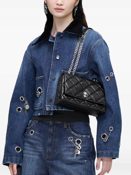 Black bags worn by a person, showing the bag's fit