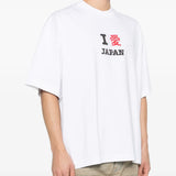 white t-shirt worn by a person, showing the t-shirt fit