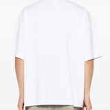 white t-shirt worn by a person, showing the t-shirt fit