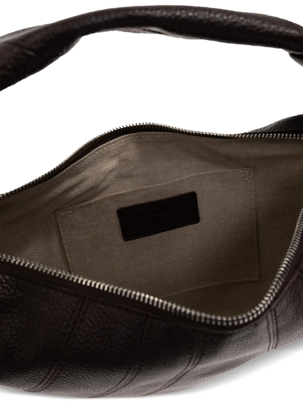 close up of brown bags, showing texture of the cow leather fabric