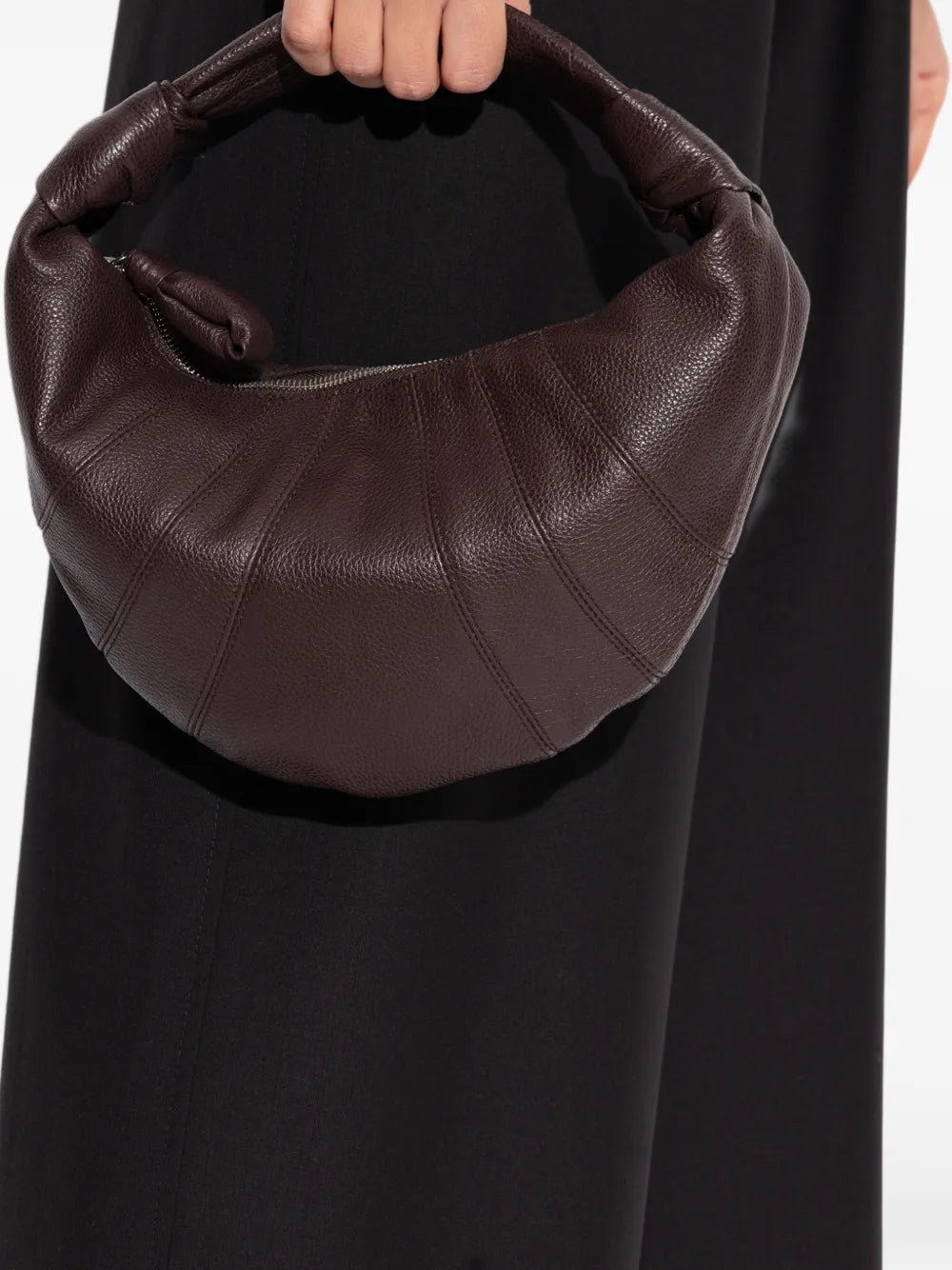 brown bags worn by a person, showing the bags fit