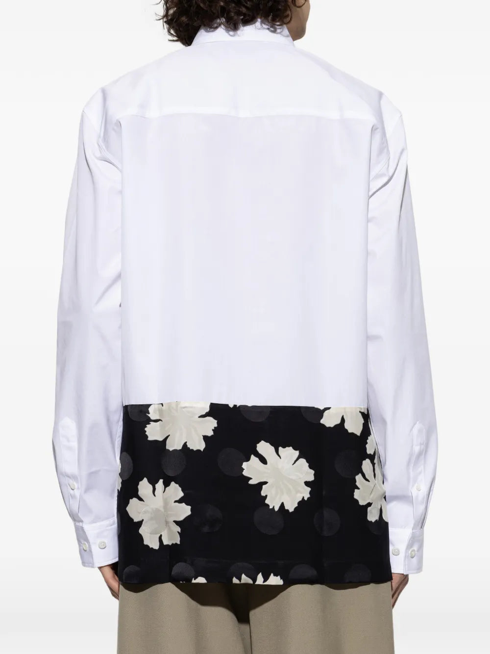 White shirt worn by a person, showing the shirt'fit