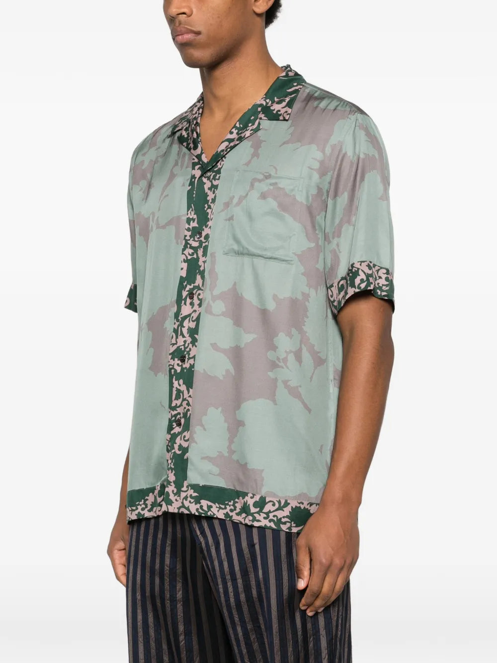 Green shirt worn by a person, showing the shirt'fit