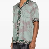 Green shirt worn by a person, showing the shirt'fit