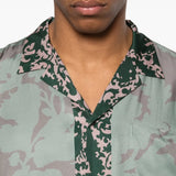 Close up of green shirt, showing texture of the viscose fabric