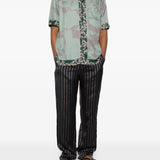 Green shirt, full body view