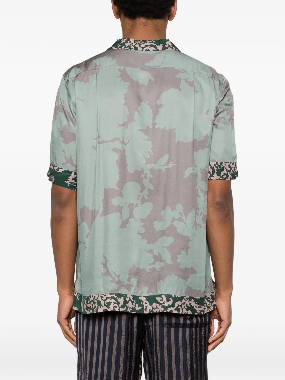 Green shirt worn by a person, showing the shirt'fit