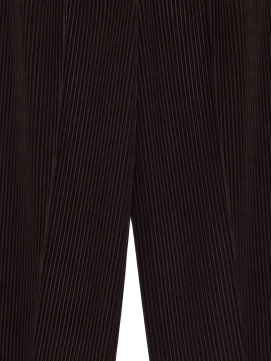 Close up of black pant, showing texture of the polyester fabric