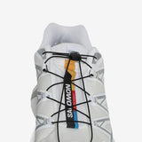 Close up of the white sneakers, showing texture of the fibres fabric