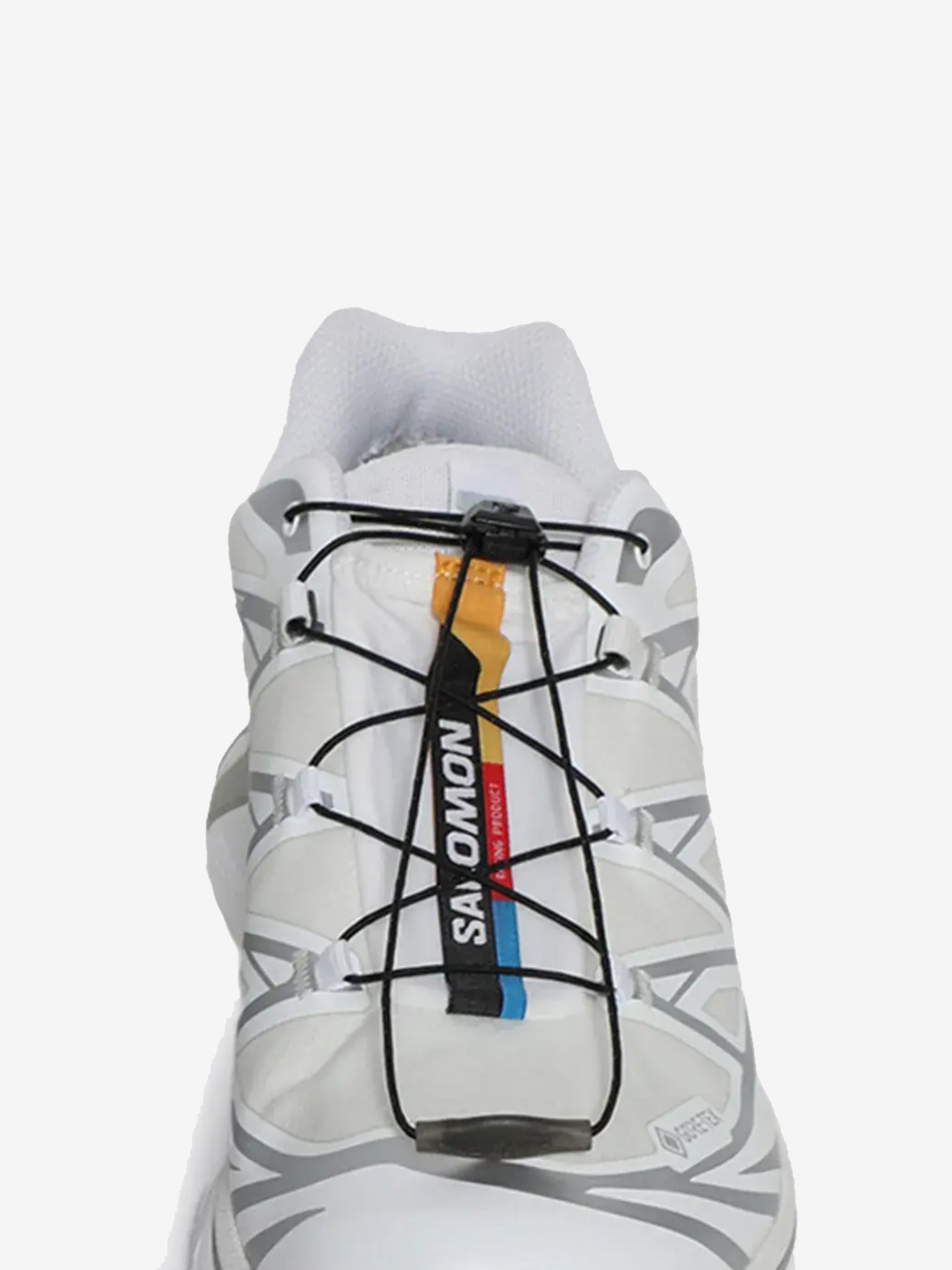 Close up of the white sneakers, showing texture of the fibres fabric