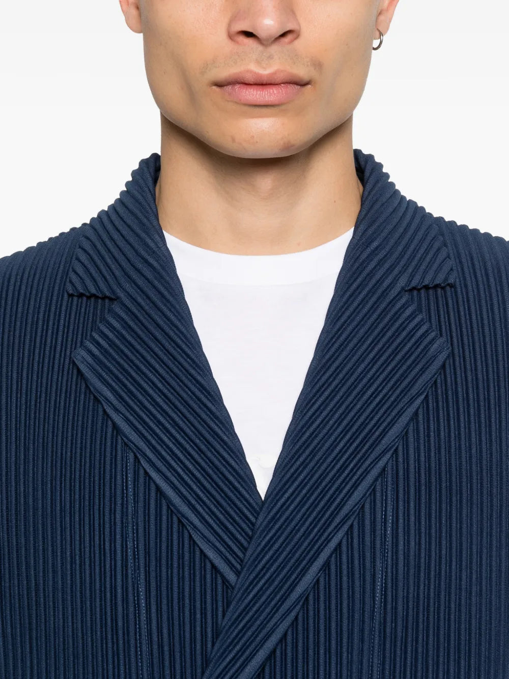close up of blue jackets, showing texture of the wool fabric
