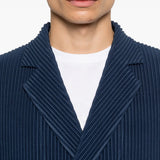 close up of blue jackets, showing texture of the wool fabric
