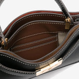 Close up  black bags,showing texture of the leather fabric