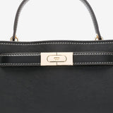 Close up  black bags,showing texture of the leather fabric
