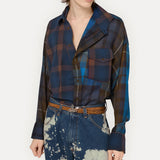 Blue shirt worn by a person, showing the shirt fit