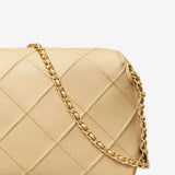 Close up of the tan bag, showing texture of the nappa leather fabric